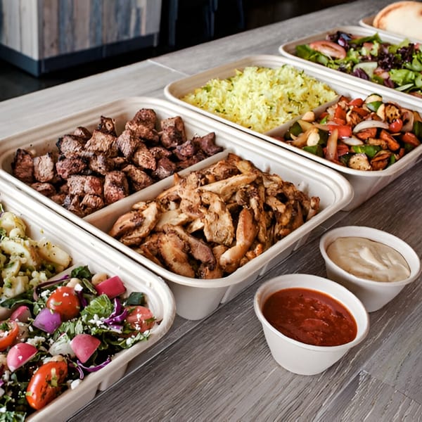 Ana's Corner Store deli meal with grilled chicken, steak, rice, salads, and sauces in takeout containers.